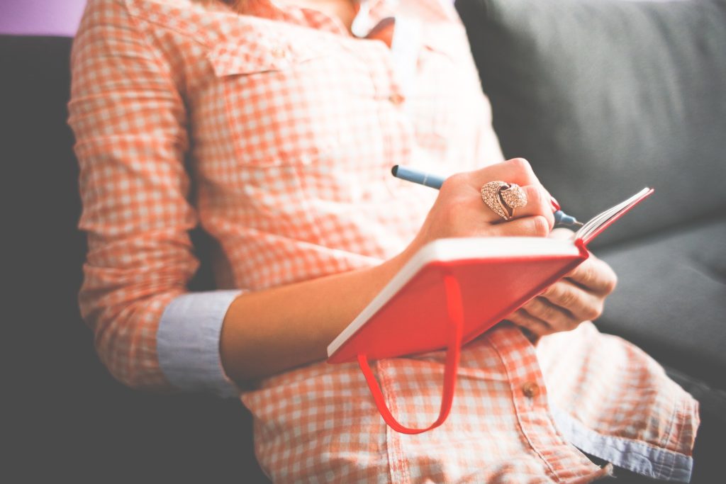 girl writing down her values