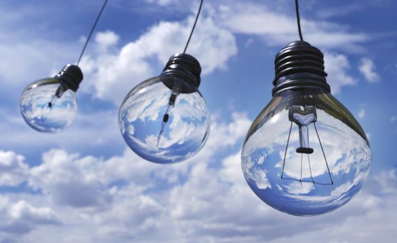 three lightbulbs over clouds